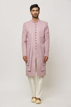 Lilac pink layered sherwani with thread work and statement buttons in art silk base. Paired with a cream aligadi pant. - Aza Fashions Fitted Pink Sherwani With Pallu, Fitted Pink Bandhgala With Zari Work, Fitted Pink Sherwani For Reception, Pink Raw Silk Sherwani With Traditional Drape, Fitted Pink Sherwani With Dabka Details, Fitted Pink Sherwani With Chikankari Embroidery, Fitted Pink Sherwani With Cutdana, Pink Fitted Sherwani With Chikankari Embroidery, Pink Fitted Sherwani With Cutdana