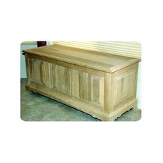 a large wooden chest sitting on top of a carpeted floor