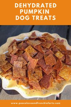 a bowl full of baked dog treats with the words, dehydrated pumpkin dog treats