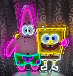 the spongebob is standing next to an illuminated sign