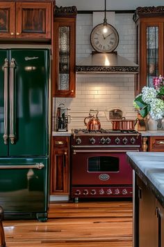 a green refrigerator freezer sitting inside of a kitchen next to a stove top oven