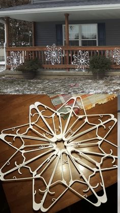 several pictures of the outside of a house with snowflakes on it and an open window