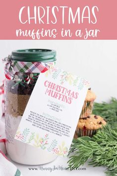 a jar filled with christmas muffins next to a cupcake