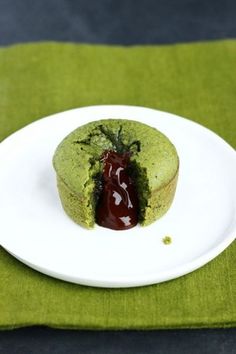 there is a small green cake on the plate