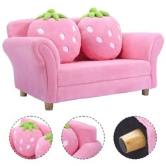 a pink couch with two strawberries on the back and four other pillows around it