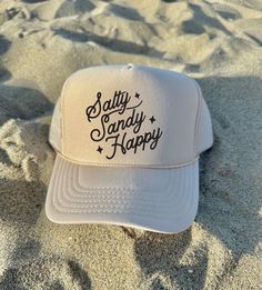 Salty Sandy Happy Women's Trucker Hat Trendy Trucker Hat Gifts for her Beach Trucker Hat River Hat Lake Life Hat Tan Trucker Hat ♥ Tan-Khaki OTTO Trucker Hat - One size fits most, Snapback mesh foam trucker hat ♥ Do not bleach or iron directly onto the design ♥ Wash on Cold - Inside out, preferable  ♥ Colors can vary from screen to screen - Please understand the actual color may vary slightly from your monitor or phone display  ♥ No refunds or exchanges since all orders are made once ordered but Beachy Cap For Beach Season, Fun Travel Hat, One Size Fits Most, Beachy Cap For Vacation, Vacation Baseball Cap, Beachy Vacation Hat, Beachy Vacation Cap Hat, Beachy Vacation Cap, Vacation Baseball Cap, One Size Fits Most, Beachy Cap Hat, One Size Fits Most