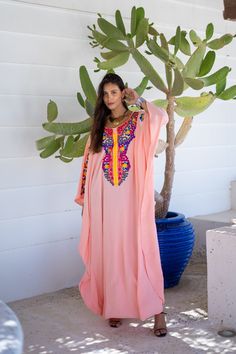 A bohemian flash caftan made of light mesh of linen and poly, the fabric is unique in that it's very flowy and not the usual feel and touch of linen. This Kaftan is ideal to wear for any casual occasion. Whether taking a trip down the shopping lane, or home-based kitty parties, or about anything else, wearing this dress will make you feel classy and comfortable. Fabric : 50% Linen, 50% Polyester. Please note that the fabric on this Kaftan has some weight to it and is meant to give off that crumb Pink Resham Embroidery Kaftan For Festivals, Pink Dabka Kaftan For Festive Occasions, Festive Pink Dabka Kaftan, Pink Dabka Kaftan For Eid, Festive Dabka Kaftan For Festival, Festive Bohemian Kaftan With Dabka Detailing, Festive Bohemian Kaftan With Dabka, Pink Resham Embroidery Kaftan For Eid, Pink V-neck Dress With Resham Embroidery