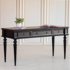 a table with two drawers and some books on it