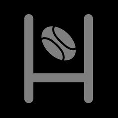 a black and white image of a bed with a tennis ball on it