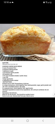 a loaf of bread sitting on top of a table next to a glass pan filled with food