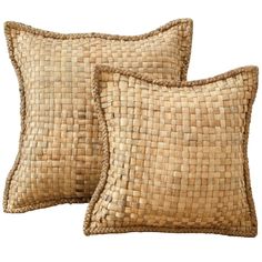 two brown woven pillows sitting next to each other