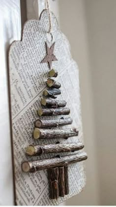 a wooden christmas tree hanging on a door