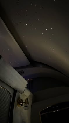 the ceiling is covered with stars in the night sky, and there are no lights on it