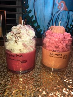 two cups filled with different types of desserts