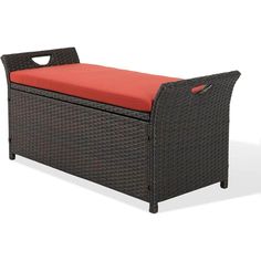 an outdoor bench with a red cushion on it