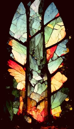 a stained glass window with leaves on it