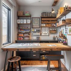 an organized craft room with lots of shelves