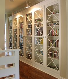 an empty room with many bookshelves in it