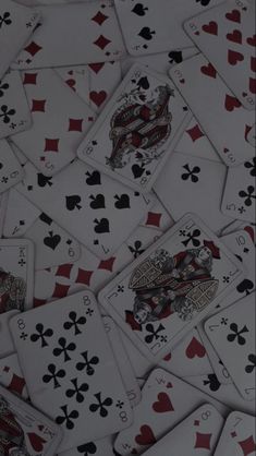 a pile of playing cards sitting on top of each other