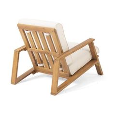 a wooden chair with white cushions sitting on top of it's back legs and arms