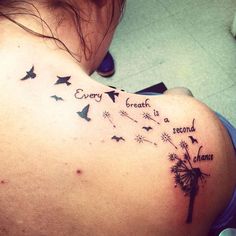 a woman's back with a dandelion tattoo saying every breath is a second chance