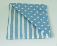 a small blue and white polka dot cloth