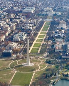 an aerial view of the washington monument in washington d c, with other buildings surrounding it