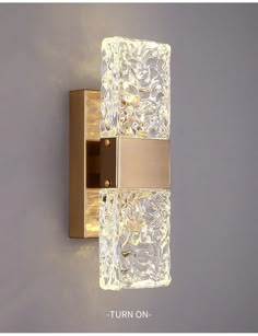 an image of a bathroom wall light with glass blocks on the front and back side