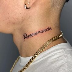 a man with a tattoo on his neck that says perseverancia in spanish