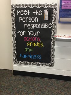 a classroom door with a sign that says meet the person responsible for your actions, grads and happiness