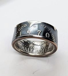 a ring with the words half dollar engraved on it