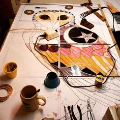 a table topped with lots of crafting supplies