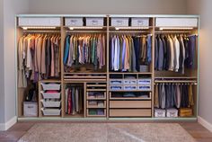 an organized closet with clothes and boxes on the bottom shelf, labeled pay komplement