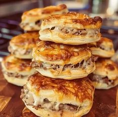 a pile of food sitting on top of a wooden cutting board