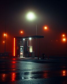 an empty gas station at night with street lights