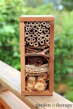 an insect hotel with the words how to build a bug hotel on it's side