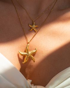 Gold Starfish Necklace 18K Gold Plated Stainless Steel Length: approx. 16-18 inches (adjustable) Gold Starfish Necklaces For Vacation, Gold Starfish Charm Necklace For Beach Season, Gold Starfish Clavicle Chain Necklace, Yellow Gold Starfish Necklace As Gift, Starfish Gold Necklace, Gold Charm Necklace With Starfish Charm, Gold Starfish Charm Necklace, Yellow Gold Star Necklaces With Starfish Charm, Gold Ocean-inspired Charm Necklaces For Summer