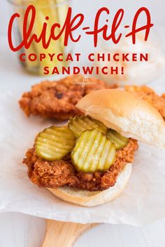 a chicken sandwich with pickles on it