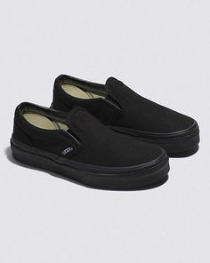 Kids Slip-On Shoe Vans Slip-ons With Rubber Sole For Streetwear, Black Sporty Slip-ons With Rubber Sole, Black Slip-ons With Vulcanized Sole For Streetwear, Black Low-top Slip-ons With Vulcanized Sole, Casual Black Slip-resistant Slip-ons, Casual Black Skate Shoes With Rubber Toe Cap, Black Casual Skate Shoes With Rubber Toe Cap, Black Slip-resistant Skate Shoes, Black Low-top Slip-ons With Rubber Sole