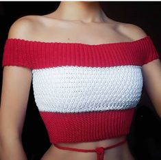 a woman wearing a red and white crop top