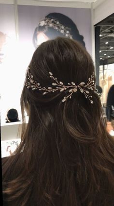 the back of a woman's head wearing a tiara