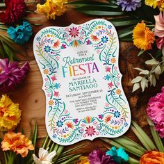 colorful flowers are scattered around the wedding card