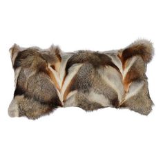 a brown and white fur pillow on a white background