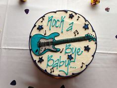 a birthday cake with a guitar on it