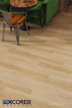 a living room scene with focus on the flooring and furniture that is made of wood