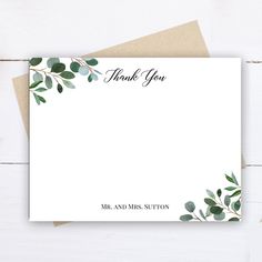 a thank card with eucalyptus leaves on it