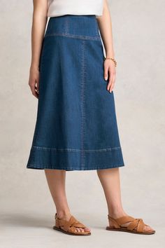 Crafted from lightweight stretch denim, our fashionable Stitch Detail Denim Skirt is a year-round essential. In Mid Wash Denim, this trendy design features a flattering midi-length and A-line silhouette. With a wide, double layer waistband that creates a lovely smoothing effect, this skirt is perfect for simple summer outfitting. For an effortless, feel-good look, pair this beauty with a tank, t-shirt or blouse. Simple Summer, Spring Wear, Scarf Poncho, Work Wear Women, Denim Midi Skirt, Denim Details, Wearing Clothes, Knitwear Cardigan, Skirt Design