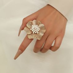 The ring is made from gold-plated over brass and set with lovely resin pearls, featuring a large flower design. This subtle back-to-basics accessory will be an excellent gift for a woman in your life. It would be perfect for Mother's Day, Wedding Day, Birthday, Anniversary or any other occasion. 👌 M A T E R I A L• Gold-plated Brass• Resin Pearls• This product is hypoallergenic (nickel free) and tarnish resistant 📏 S I Z E• Length: 5.6 cm (2.2 inch)• Weight: 6.8 g Fashion Romantic, Color Rings, Romantic Fashion, Costume Jewelry Rings, Wedding Party Jewelry, Trendy Ring, Party Rings, Bff Gifts, Women Ring