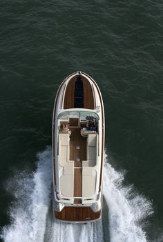 a small boat is traveling through the water