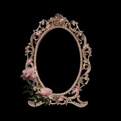 an ornate mirror with pink flowers in it